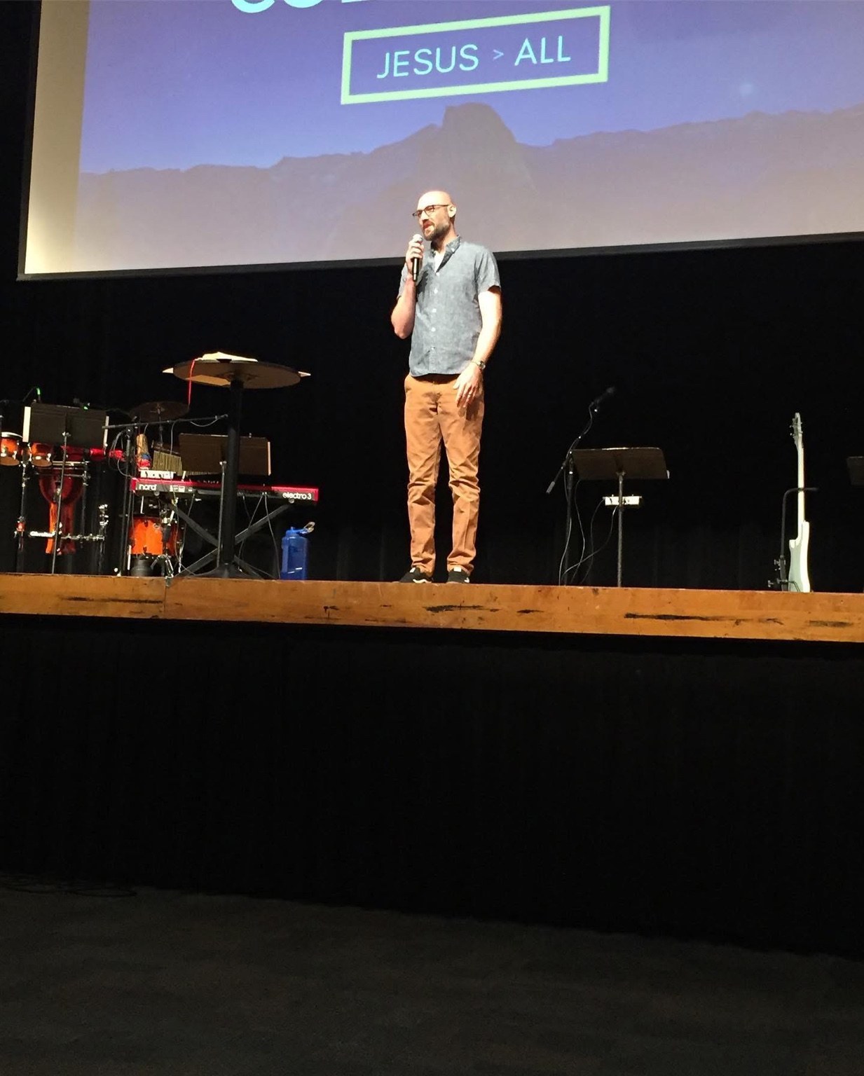 Ryan preaching on stage at church